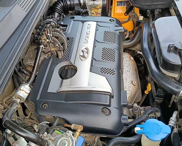 Черный Хендай Туксон, объемом двигателя 1.98 л и пробегом 256 тыс. км за 8000 $, фото 3 на Automoto.ua