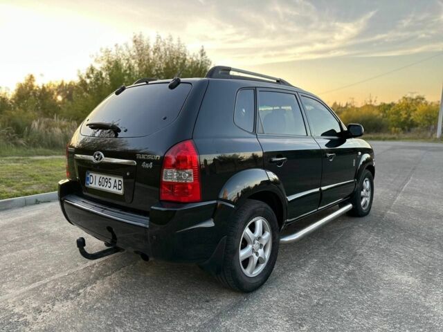 Чорний Хендай Туксон, об'ємом двигуна 2 л та пробігом 235 тис. км за 6700 $, фото 9 на Automoto.ua