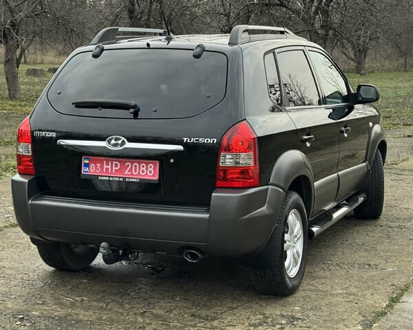 Черный Хендай Туксон, объемом двигателя 2 л и пробегом 201 тыс. км за 7750 $, фото 7 на Automoto.ua
