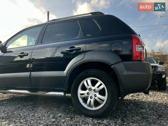 Черный Хендай Туксон, объемом двигателя 1.98 л и пробегом 191 тыс. км за 8300 $, фото 16 на Automoto.ua