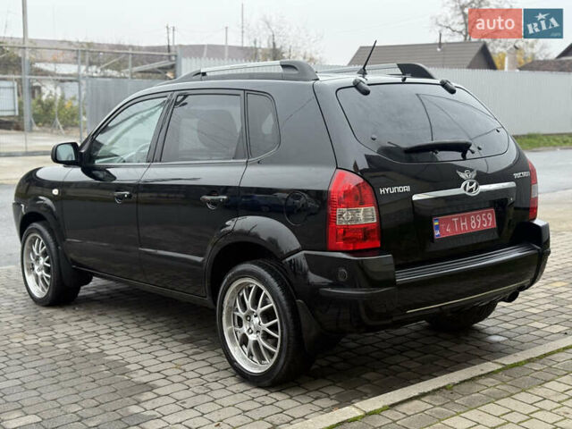 Черный Хендай Туксон, объемом двигателя 1.98 л и пробегом 231 тыс. км за 7750 $, фото 6 на Automoto.ua