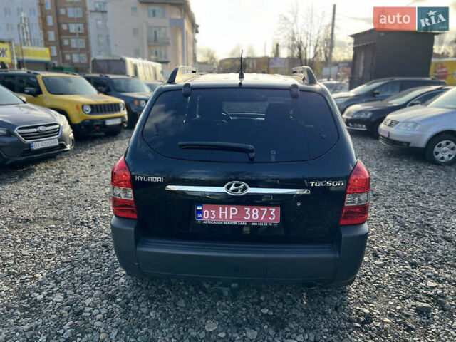 Черный Хендай Туксон, объемом двигателя 1.98 л и пробегом 191 тыс. км за 8300 $, фото 4 на Automoto.ua