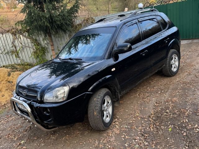 Черный Хендай Туксон, объемом двигателя 2 л и пробегом 210 тыс. км за 7200 $, фото 1 на Automoto.ua