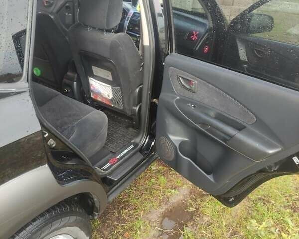 Хендай Туксон 2006 в Заречном на Automoto.ua Черный Хендай Туксон, объемом двигателя 2 л и пробегом 179 тыс. км за 7200 $, фото 9 на Automoto.ua