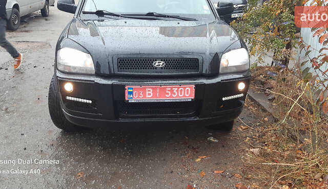 Чорний Хендай Туксон, об'ємом двигуна 1.99 л та пробігом 243 тис. км за 8850 $, фото 7 на Automoto.ua