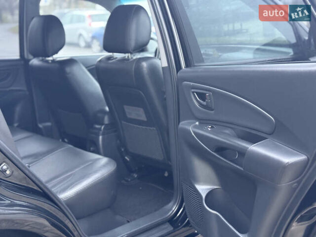 Черный Хендай Туксон, объемом двигателя 1.98 л и пробегом 231 тыс. км за 7750 $, фото 27 на Automoto.ua