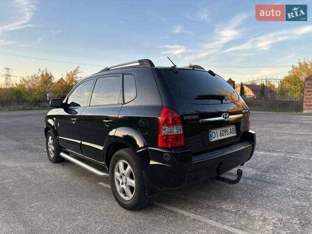 Черный Хендай Туксон, объемом двигателя 2 л и пробегом 235 тыс. км за 6700 $, фото 9 на Automoto.ua