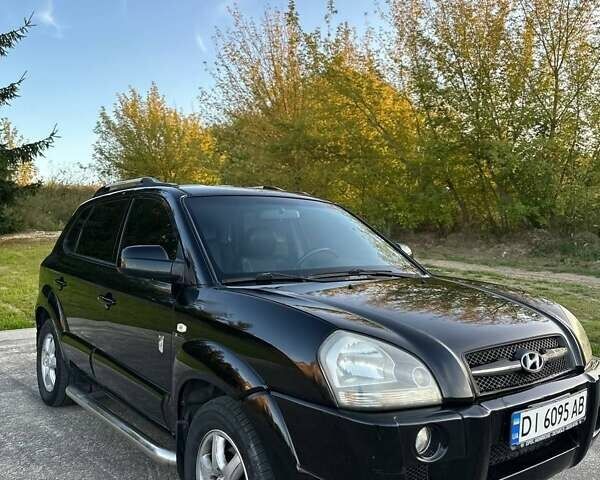 Черный Хендай Туксон, объемом двигателя 2 л и пробегом 235 тыс. км за 6700 $, фото 14 на Automoto.ua