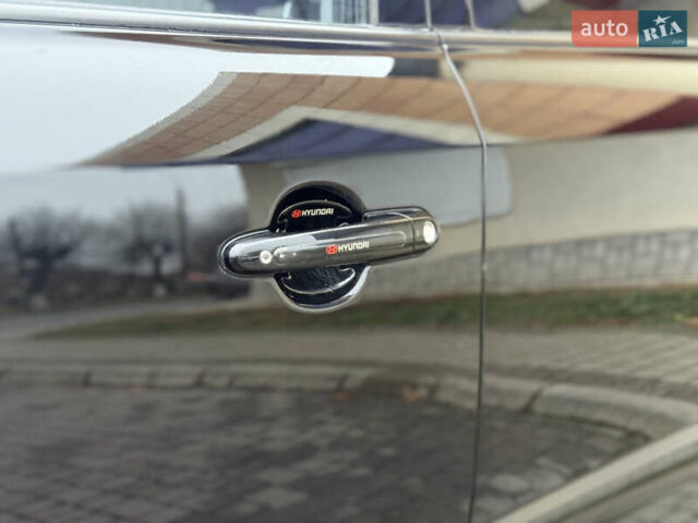 Черный Хендай Туксон, объемом двигателя 1.98 л и пробегом 231 тыс. км за 7750 $, фото 9 на Automoto.ua