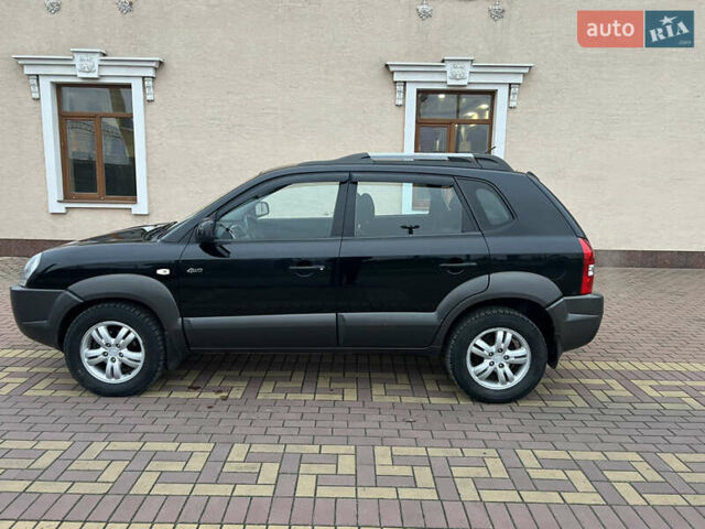 Черный Хендай Туксон, объемом двигателя 1.98 л и пробегом 227 тыс. км за 6900 $, фото 9 на Automoto.ua