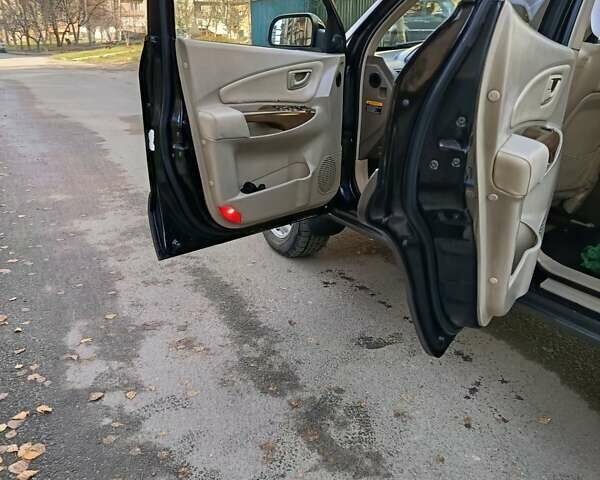 Черный Хендай Туксон, объемом двигателя 1.98 л и пробегом 256 тыс. км за 8000 $, фото 6 на Automoto.ua