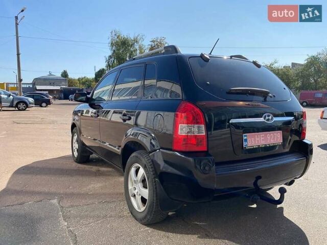Чорний Хендай Туксон, об'ємом двигуна 2 л та пробігом 230 тис. км за 7300 $, фото 4 на Automoto.ua