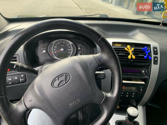 Черный Хендай Туксон, объемом двигателя 1.99 л и пробегом 290 тыс. км за 7700 $, фото 9 на Automoto.ua