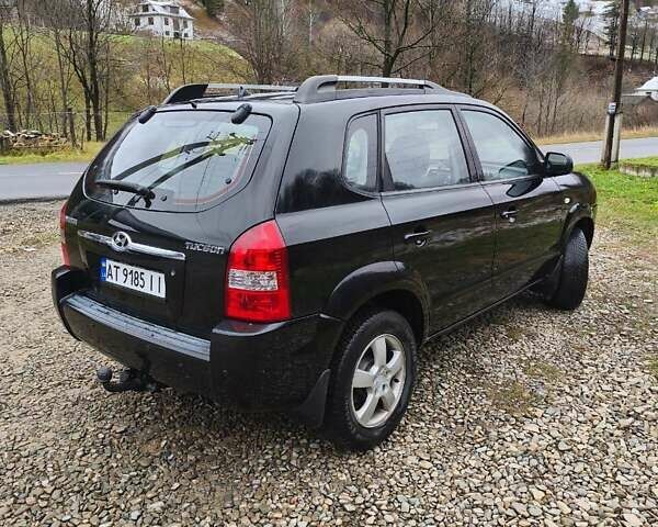 Чорний Хендай Туксон, об'ємом двигуна 2 л та пробігом 271 тис. км за 6599 $, фото 4 на Automoto.ua