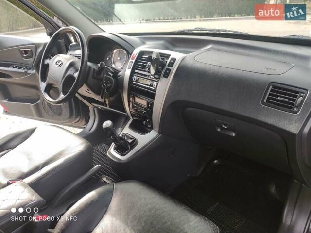 Черный Хендай Туксон, объемом двигателя 2 л и пробегом 237 тыс. км за 7999 $, фото 37 на Automoto.ua