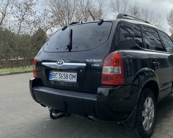 Черный Хендай Туксон, объемом двигателя 1.99 л и пробегом 290 тыс. км за 7700 $, фото 2 на Automoto.ua