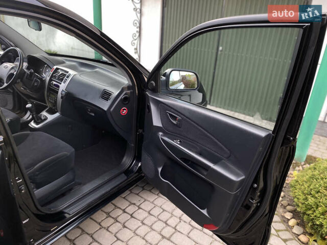 Чорний Хендай Туксон, об'ємом двигуна 1.98 л та пробігом 233 тис. км за 7650 $, фото 43 на Automoto.ua