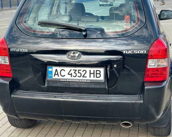 Черный Хендай Туксон, объемом двигателя 1.98 л и пробегом 277 тыс. км за 5350 $, фото 10 на Automoto.ua