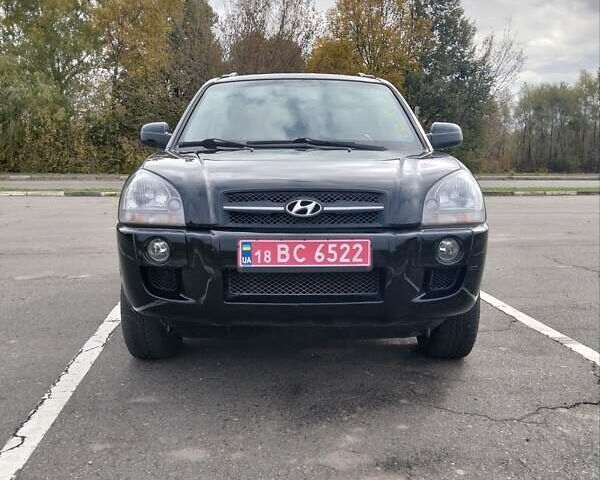 Черный Хендай Туксон, объемом двигателя 2 л и пробегом 127 тыс. км за 7590 $, фото 9 на Automoto.ua