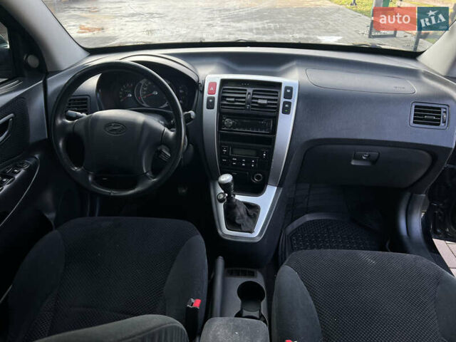 Черный Хендай Туксон, объемом двигателя 2 л и пробегом 355 тыс. км за 7000 $, фото 14 на Automoto.ua