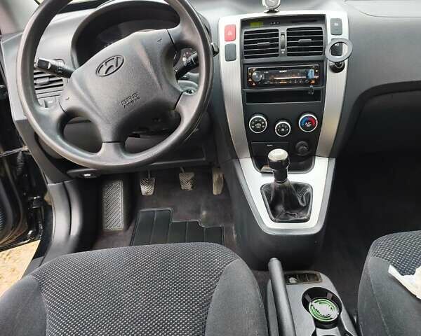 Чорний Хендай Туксон, об'ємом двигуна 2 л та пробігом 271 тис. км за 6599 $, фото 8 на Automoto.ua