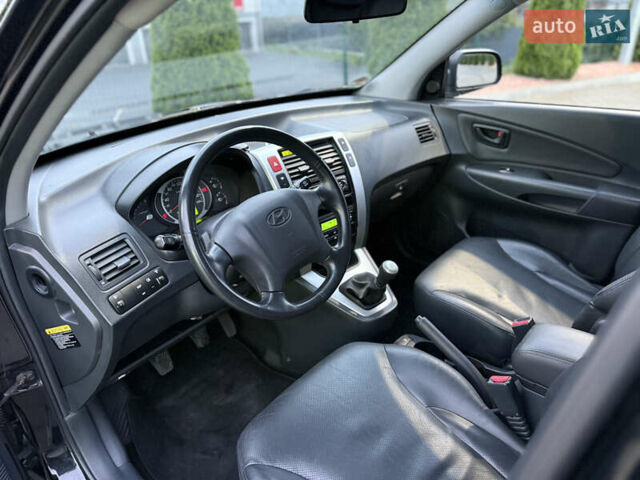 Чорний Хендай Туксон, об'ємом двигуна 2 л та пробігом 204 тис. км за 7750 $, фото 11 на Automoto.ua