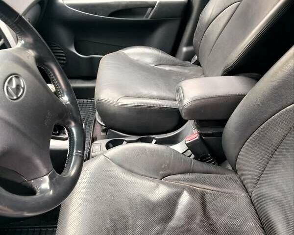 Черный Хендай Туксон, объемом двигателя 2 л и пробегом 127 тыс. км за 7590 $, фото 41 на Automoto.ua