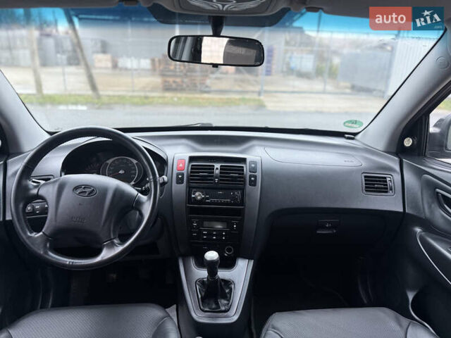 Черный Хендай Туксон, объемом двигателя 1.98 л и пробегом 231 тыс. км за 7750 $, фото 20 на Automoto.ua