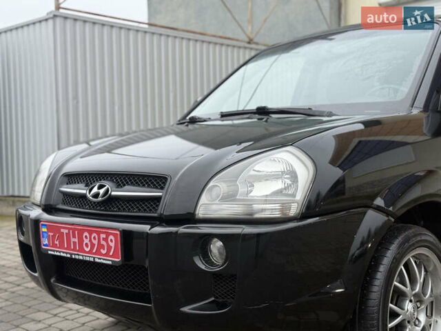 Черный Хендай Туксон, объемом двигателя 1.98 л и пробегом 231 тыс. км за 7750 $, фото 10 на Automoto.ua