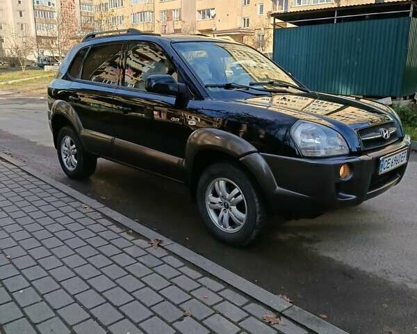 Черный Хендай Туксон, объемом двигателя 1.98 л и пробегом 256 тыс. км за 8000 $, фото 1 на Automoto.ua