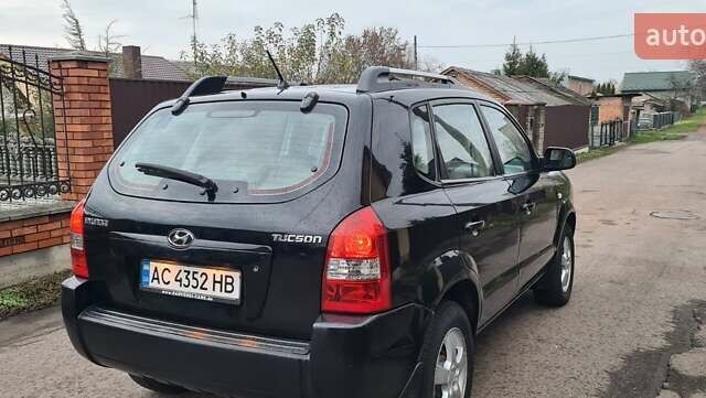Черный Хендай Туксон, объемом двигателя 1.98 л и пробегом 277 тыс. км за 5350 $, фото 21 на Automoto.ua