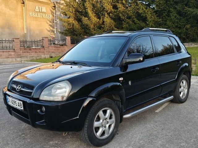 Чорний Хендай Туксон, об'ємом двигуна 2 л та пробігом 235 тис. км за 6700 $, фото 3 на Automoto.ua