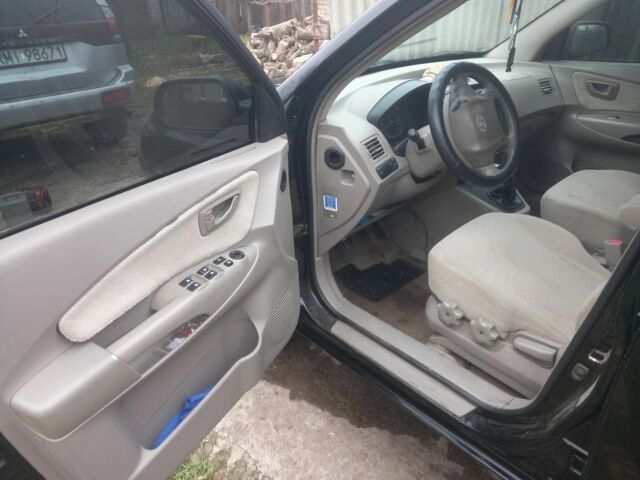 Черный Хендай Туксон, объемом двигателя 2 л и пробегом 395 тыс. км за 4500 $, фото 8 на Automoto.ua