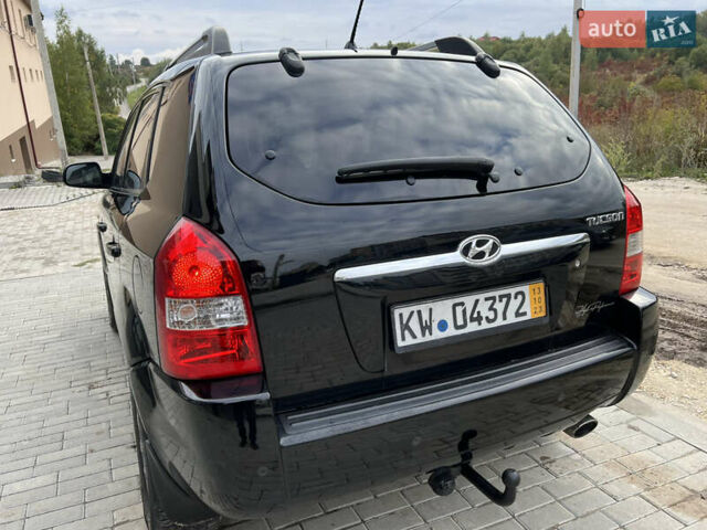 Чорний Хендай Туксон, об'ємом двигуна 2 л та пробігом 144 тис. км за 6599 $, фото 14 на Automoto.ua