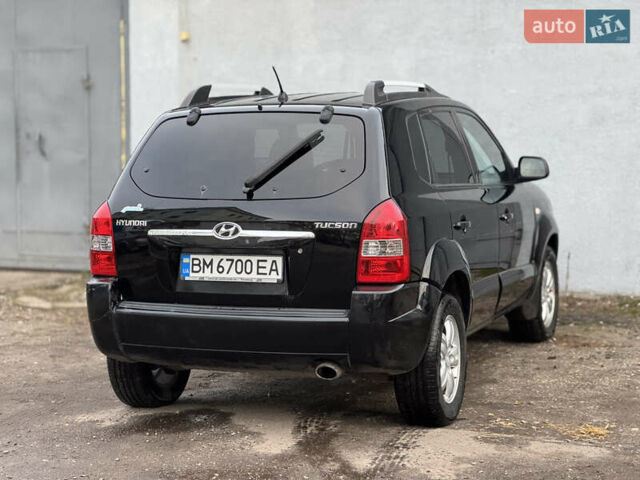 Черный Хендай Туксон, объемом двигателя 1.98 л и пробегом 198 тыс. км за 7500 $, фото 4 на Automoto.ua