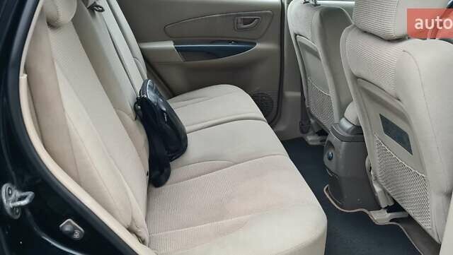 Черный Хендай Туксон, объемом двигателя 1.98 л и пробегом 277 тыс. км за 5350 $, фото 20 на Automoto.ua