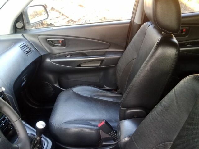 Черный Хендай Туксон, объемом двигателя 2 л и пробегом 203 тыс. км за 7500 $, фото 5 на Automoto.ua