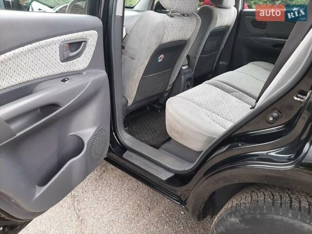Черный Хендай Туксон, объемом двигателя 2 л и пробегом 216 тыс. км за 7600 $, фото 13 на Automoto.ua