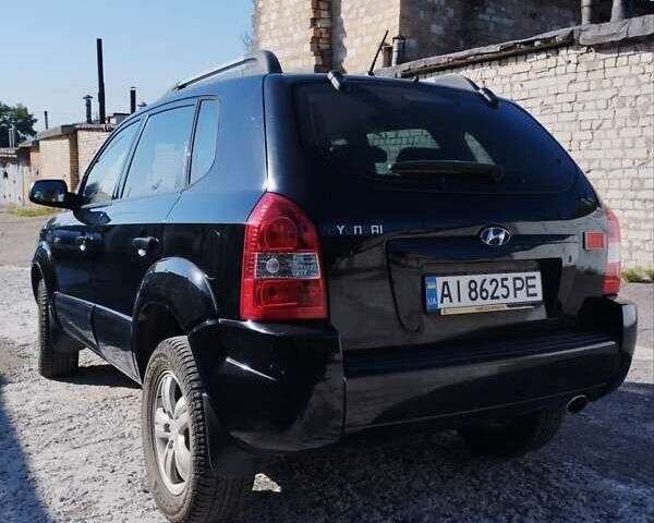 Черный Хендай Туксон, объемом двигателя 1.98 л и пробегом 190 тыс. км за 7800 $, фото 3 на Automoto.ua