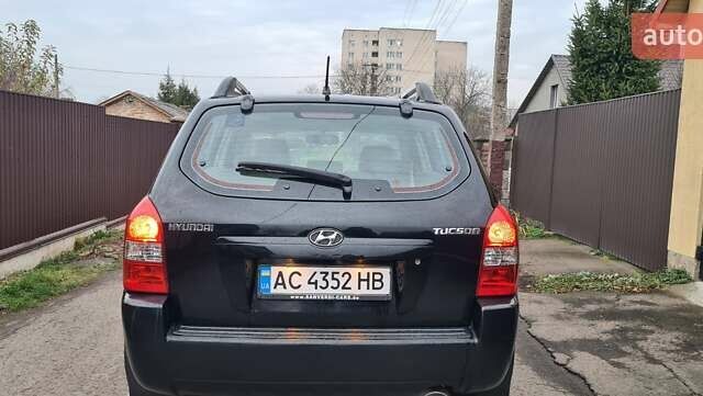 Черный Хендай Туксон, объемом двигателя 1.98 л и пробегом 277 тыс. км за 5350 $, фото 23 на Automoto.ua
