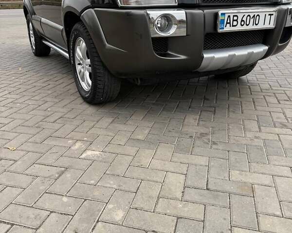 Чорний Хендай Туксон, об'ємом двигуна 2 л та пробігом 124 тис. км за 7950 $, фото 10 на Automoto.ua