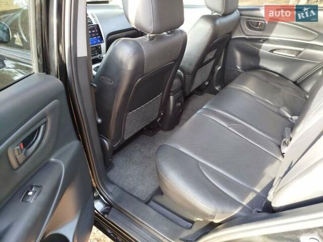 Черный Хендай Туксон, объемом двигателя 2 л и пробегом 195 тыс. км за 8300 $, фото 11 на Automoto.ua