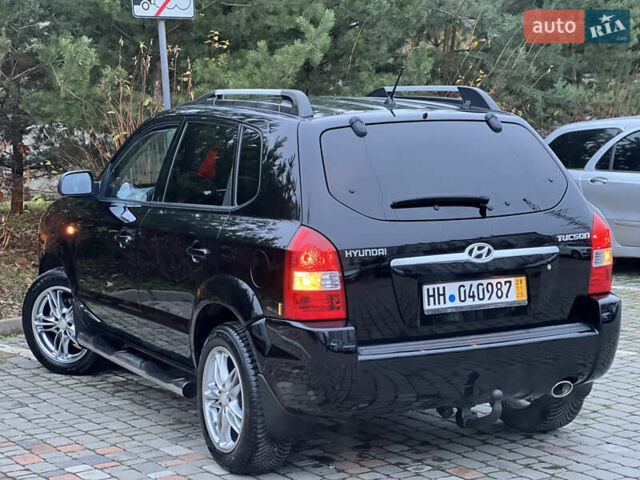 Чорний Хендай Туксон, об'ємом двигуна 1.98 л та пробігом 170 тис. км за 6999 $, фото 58 на Automoto.ua