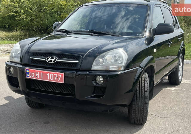 Черный Хендай Туксон, объемом двигателя 2 л и пробегом 236 тыс. км за 6950 $, фото 1 на Automoto.ua
