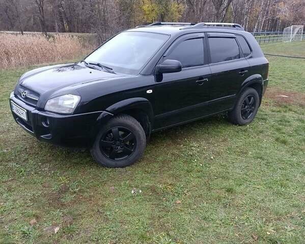 Черный Хендай Туксон, объемом двигателя 2 л и пробегом 220 тыс. км за 8300 $, фото 7 на Automoto.ua