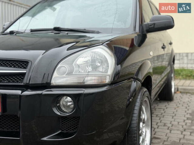 Черный Хендай Туксон, объемом двигателя 1.98 л и пробегом 231 тыс. км за 7750 $, фото 11 на Automoto.ua