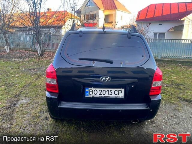 Черный Хендай Туксон, объемом двигателя 2 л и пробегом 227 тыс. км за 8000 $, фото 2 на Automoto.ua