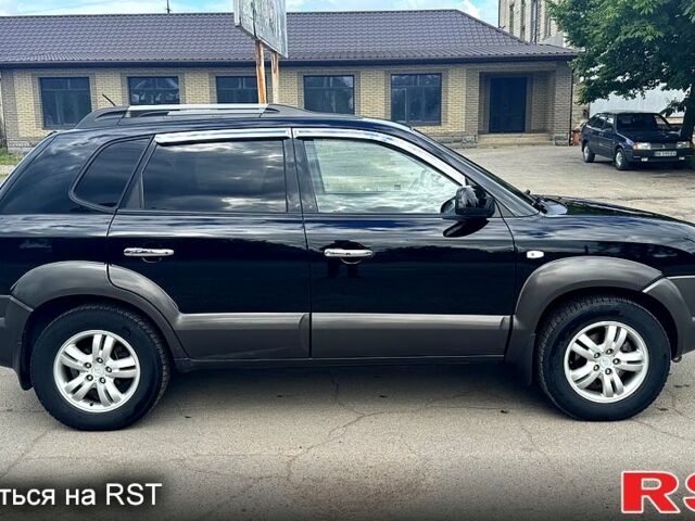 Черный Хендай Туксон, объемом двигателя 2 л и пробегом 192 тыс. км за 7700 $, фото 4 на Automoto.ua
