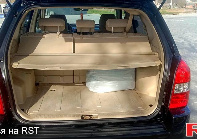 Черный Хендай Туксон, объемом двигателя 2 л и пробегом 260 тыс. км за 8000 $, фото 11 на Automoto.ua