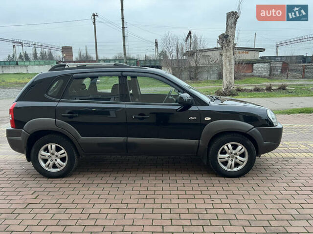 Черный Хендай Туксон, объемом двигателя 1.98 л и пробегом 227 тыс. км за 6900 $, фото 15 на Automoto.ua